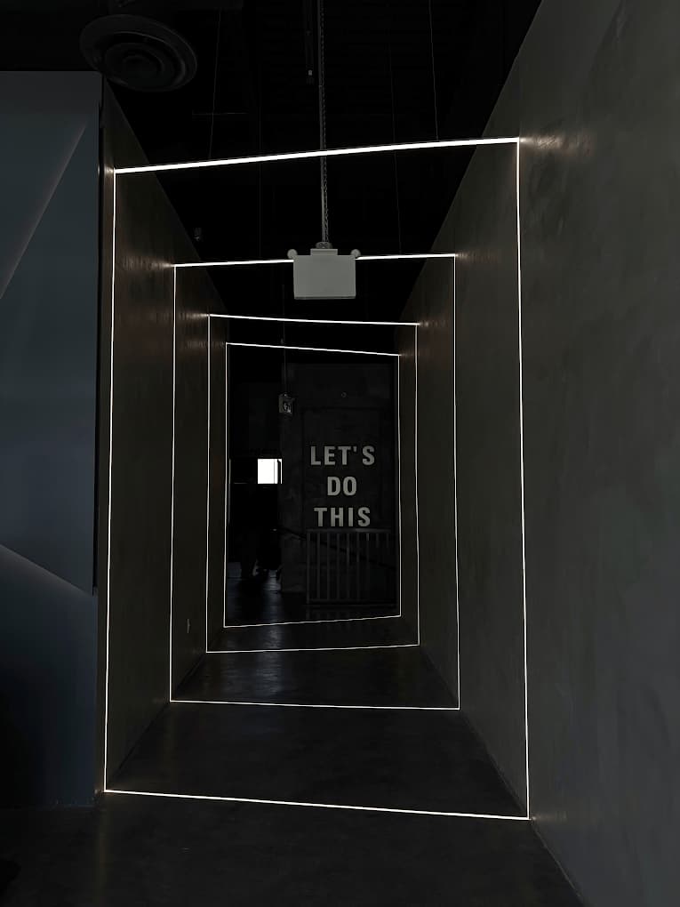 Hallway leading to indoor golf bays at Forged Golf