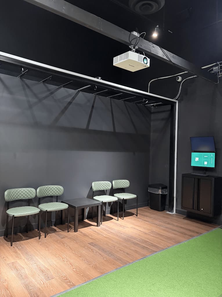 Seating area for players and guests at Forged Golf