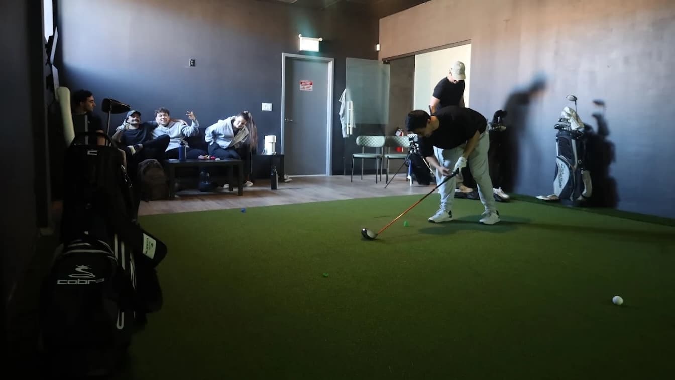 Friends having fun at Forged Golf indoor golf in Mississauga